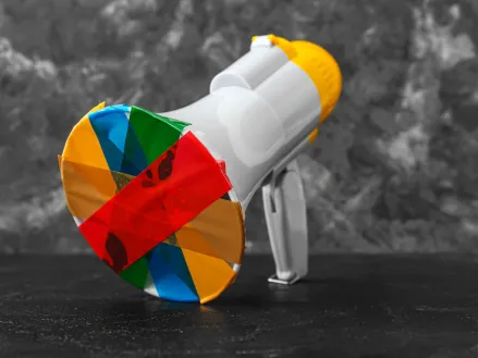 Taped megaphone on dark table